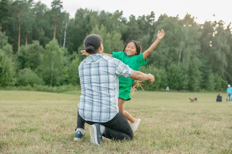 girl running towards a man for a hug