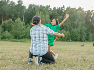 girl running towards a man for a hug
